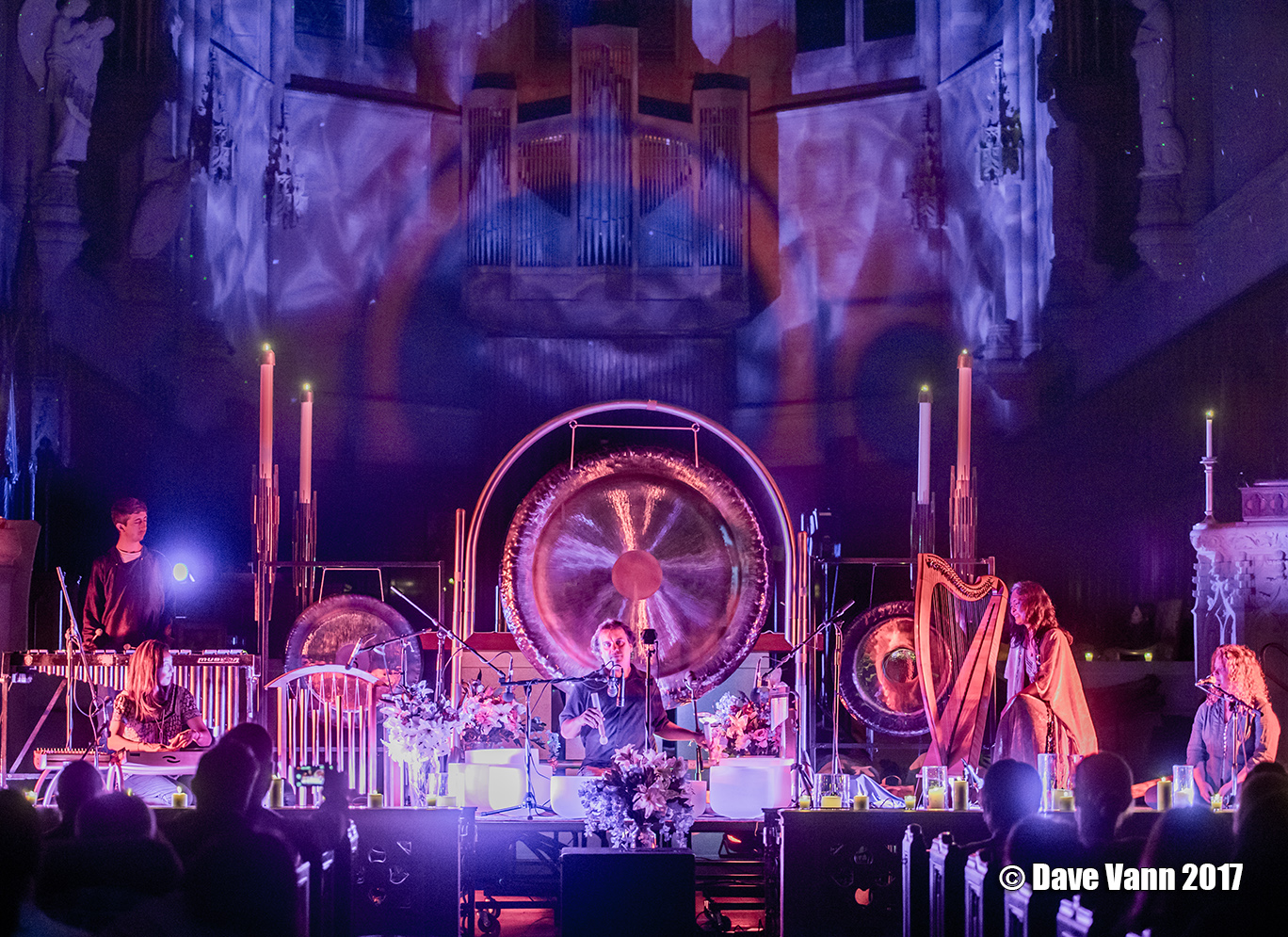 Musicians performing a sound healing symphony in a church